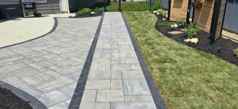 Replacing a cracked concrete walkway with a paver walkway